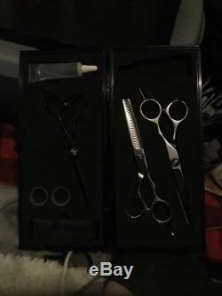 Three peice Paul Mitchell shear set co, es with silver and black